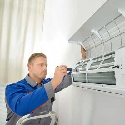 Technician checking AC